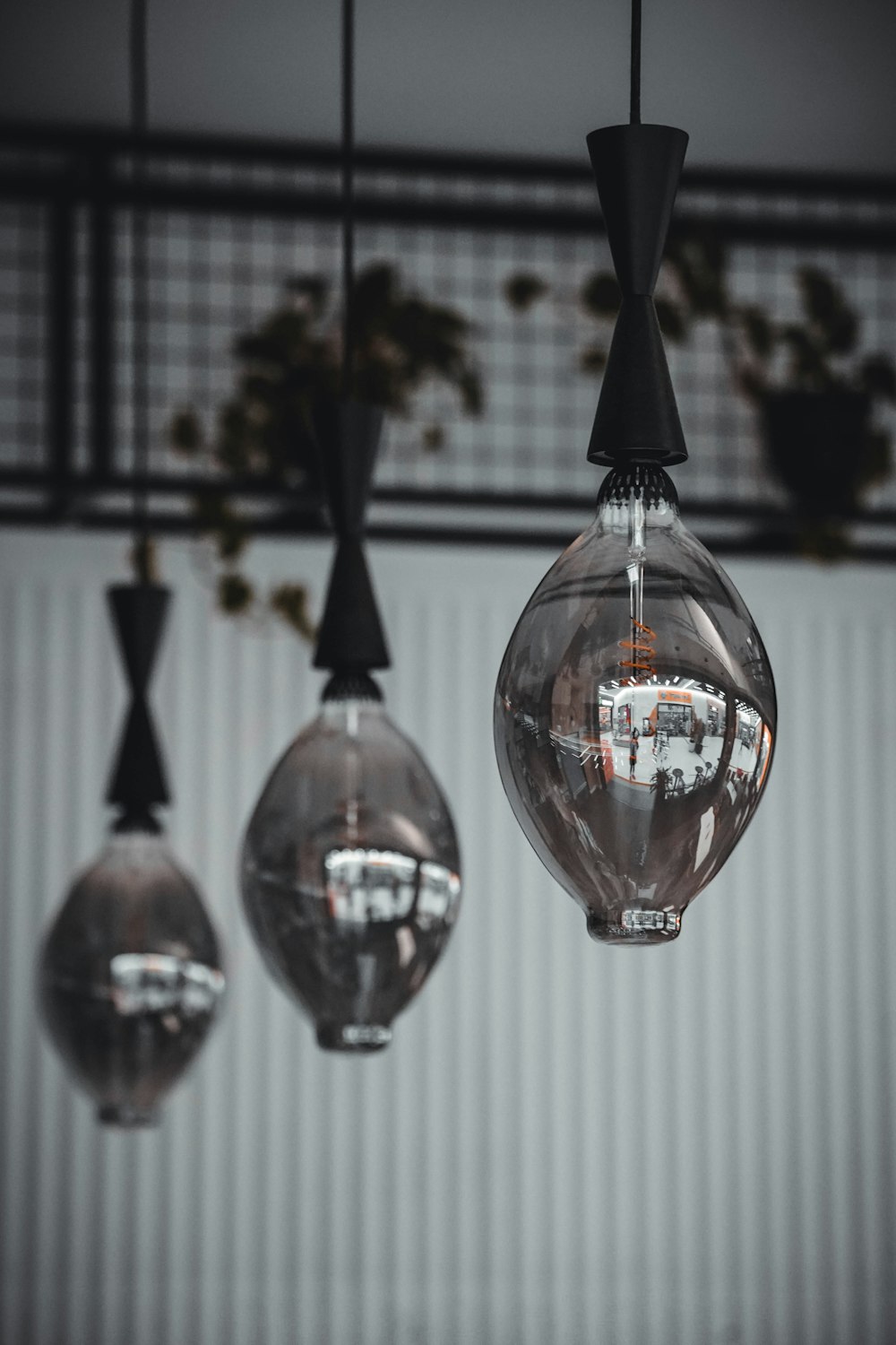 a group of glass balls hanging from a ceiling