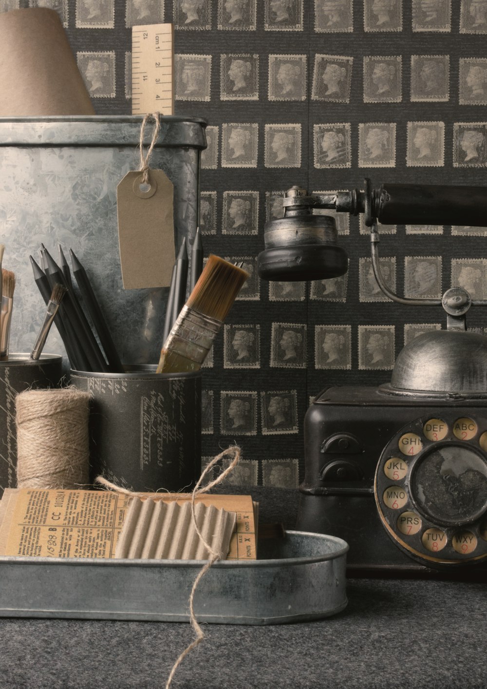 an old fashioned telephone and other items on a table