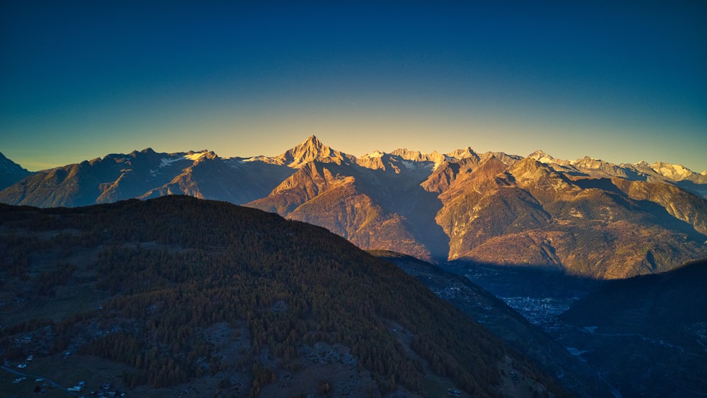 a view of a mountain range at sunset