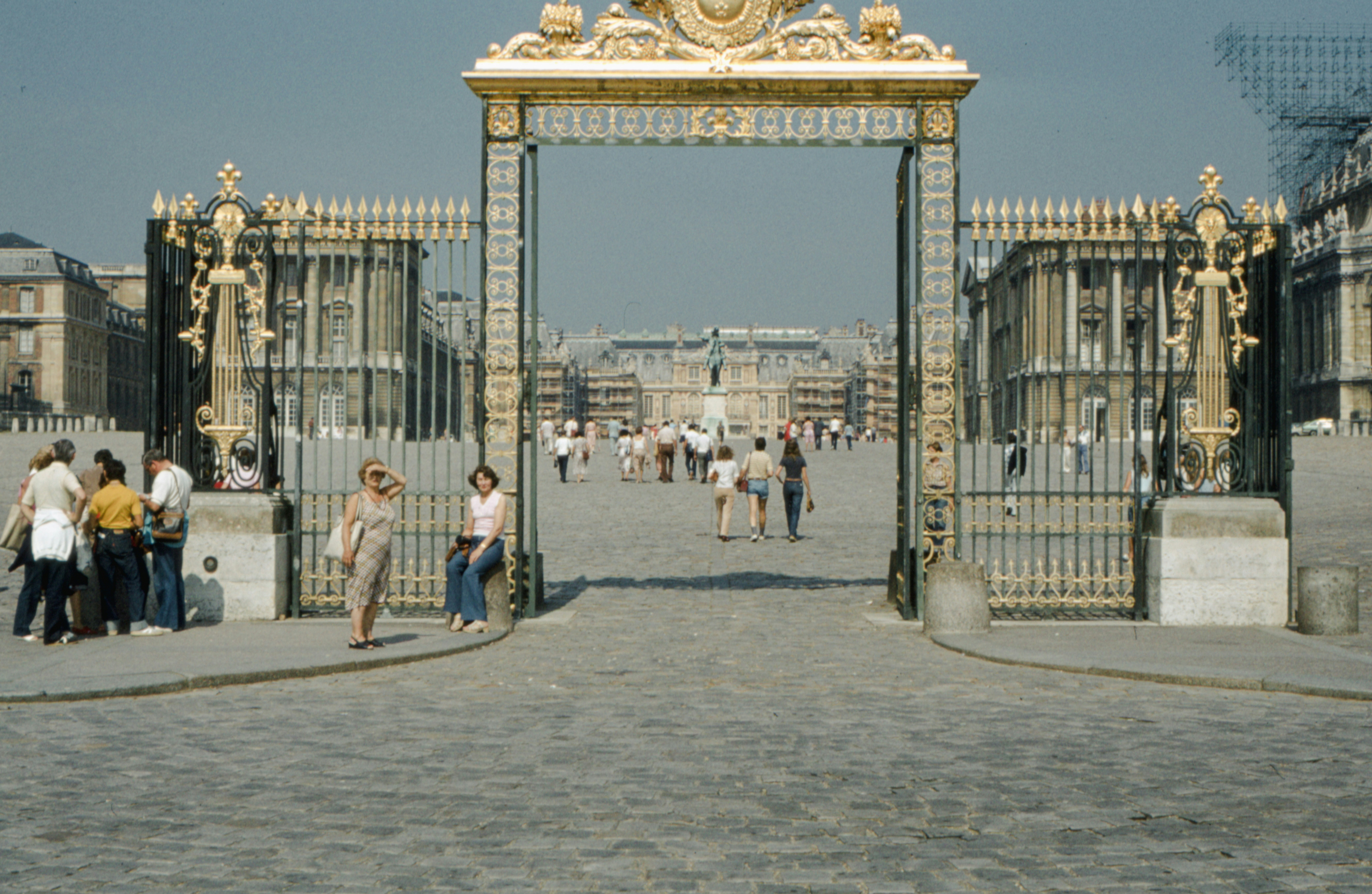 a group of people standing in front of a gate