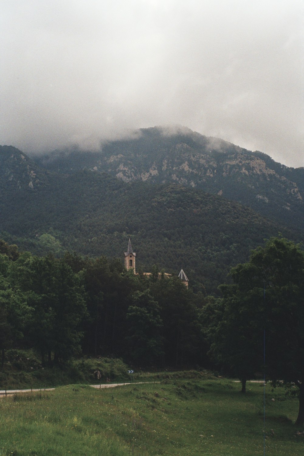 a large mountain with a church on top of it