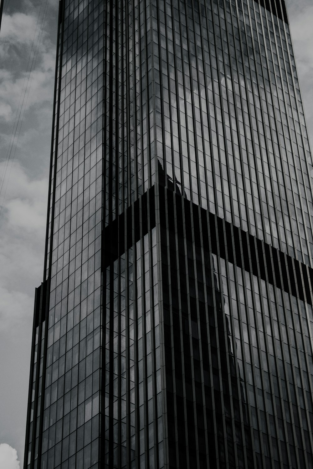 a black and white photo of a tall building