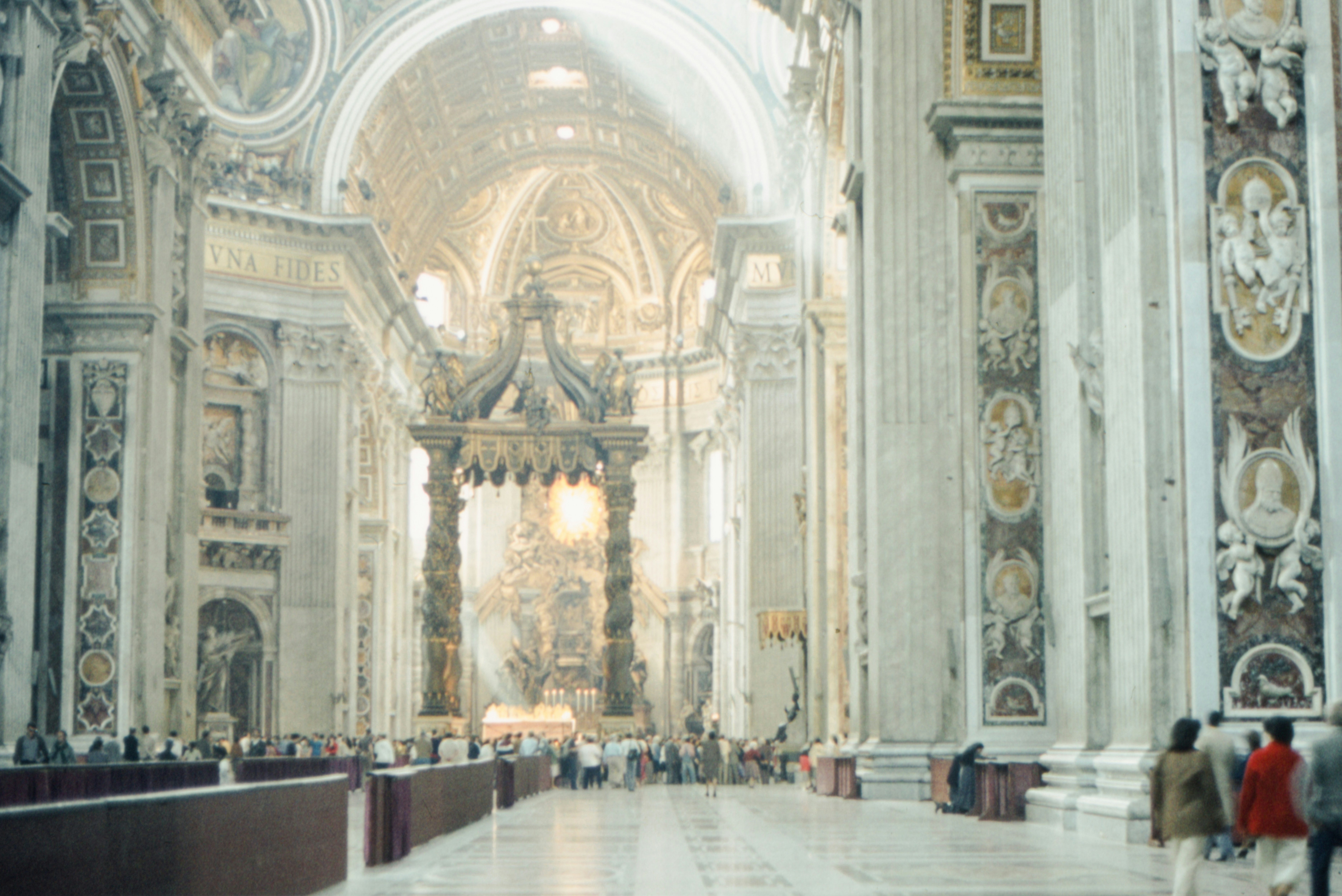 a group of people standing inside of a church