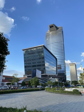 a very tall building sitting in the middle of a park