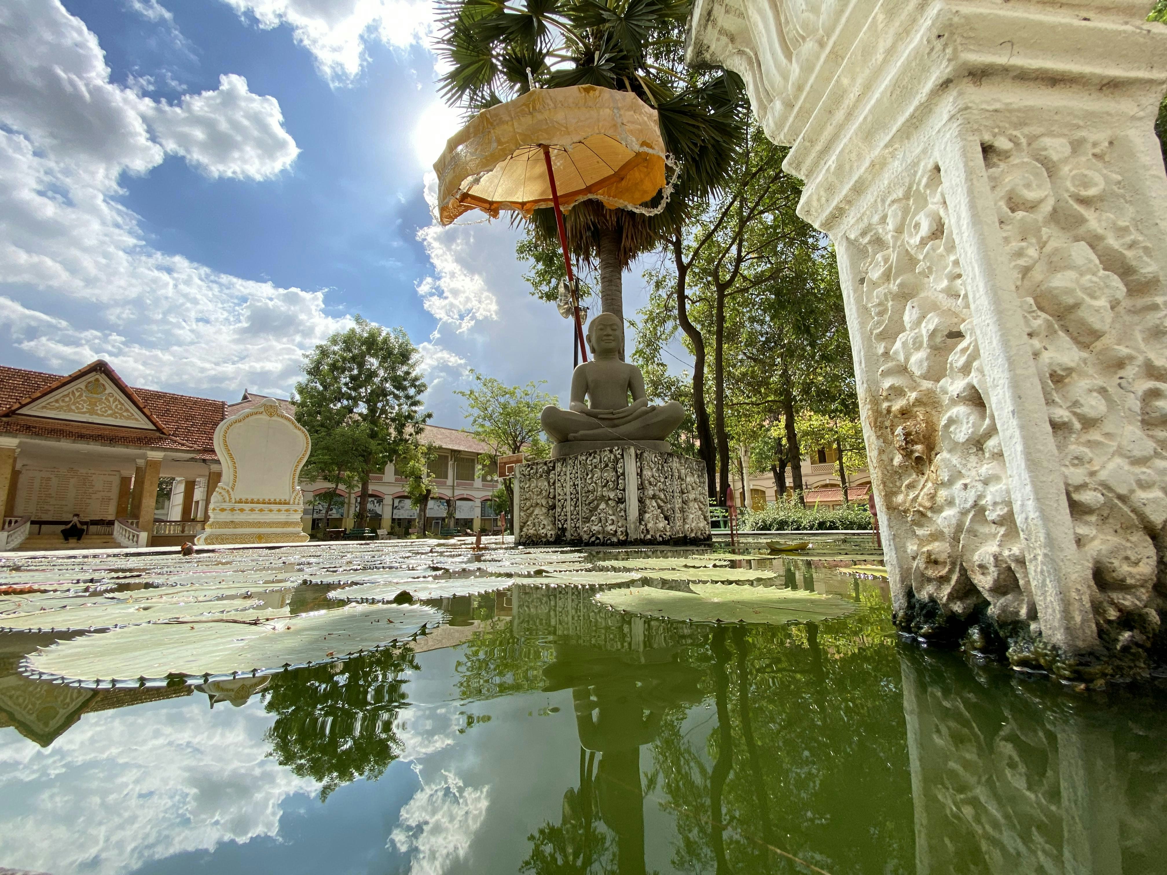 a fountain with an umbrella in the middle of it