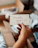 a hand holding a note that says thank you