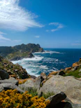 a view of the ocean from the top of a hill