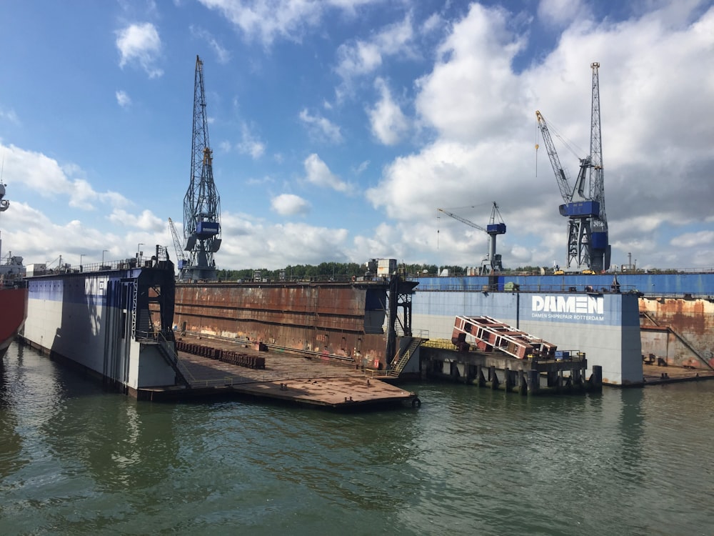 a large boat is docked at a dock