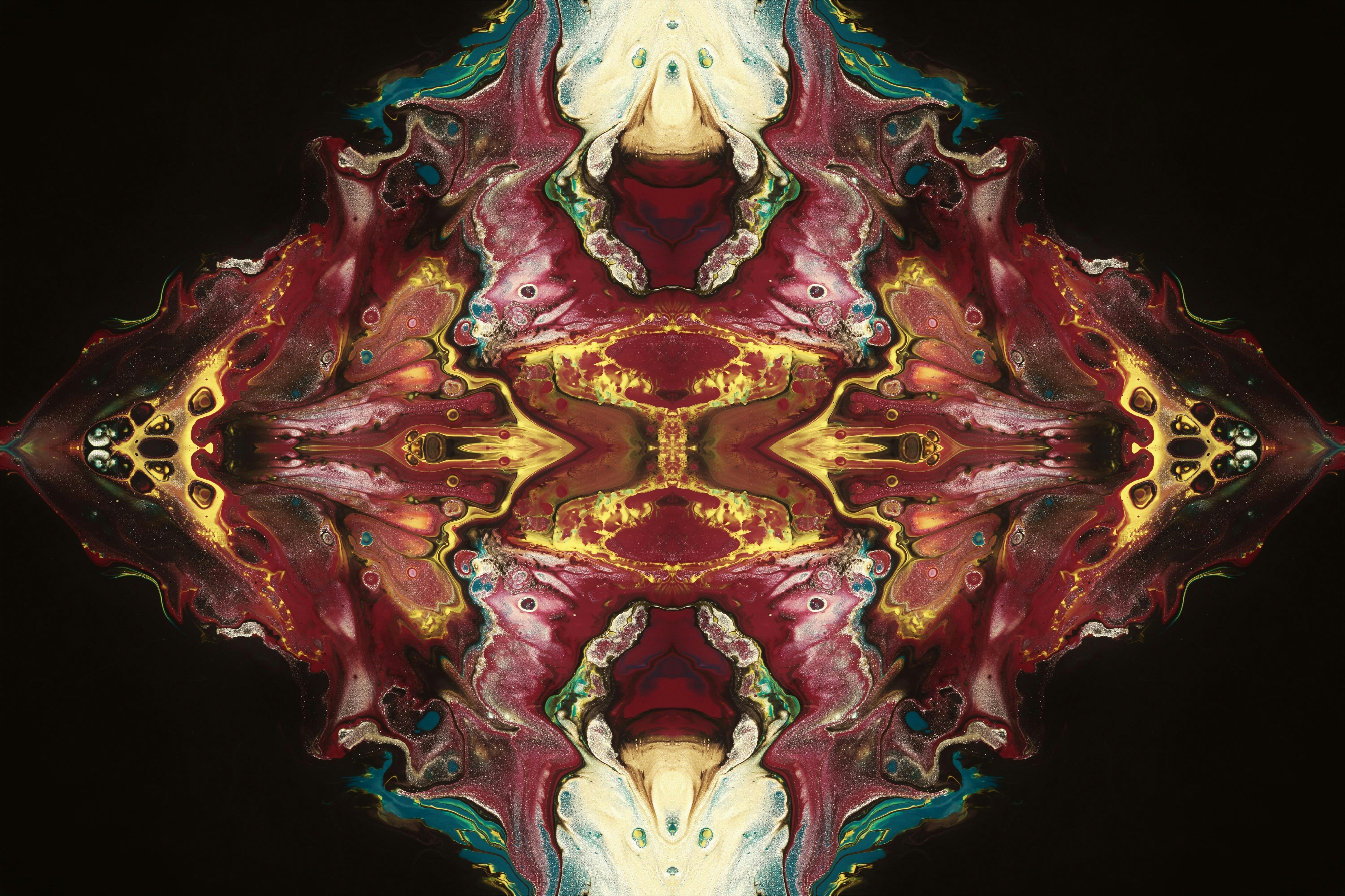 an abstract image of a red and yellow flower