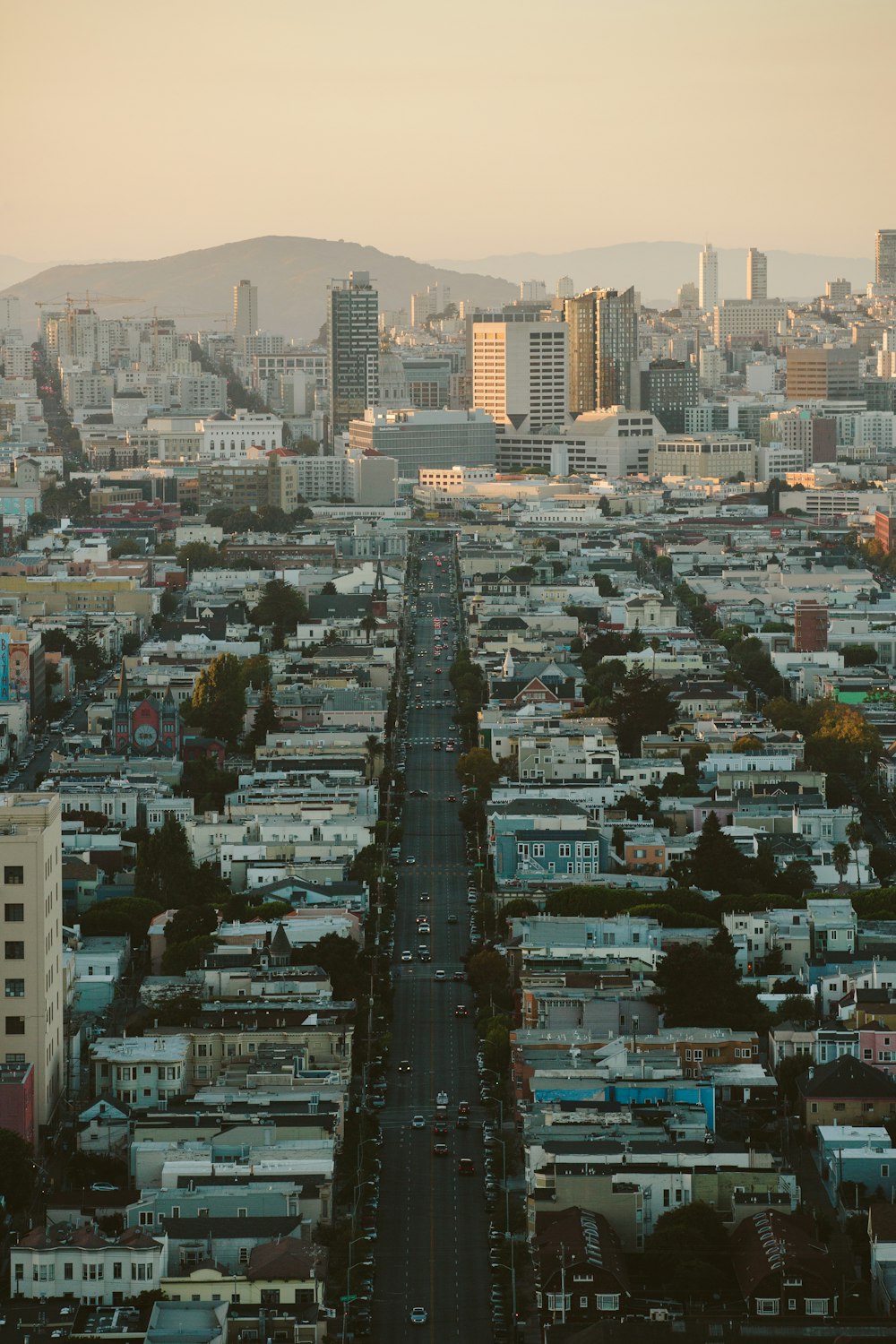 a view of a city from the top of a hill