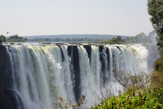 a large waterfall with water pouring out of it
