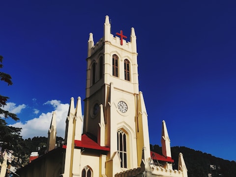 a church with a clock on the front of it