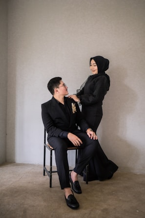 a man and a woman sitting on a chair