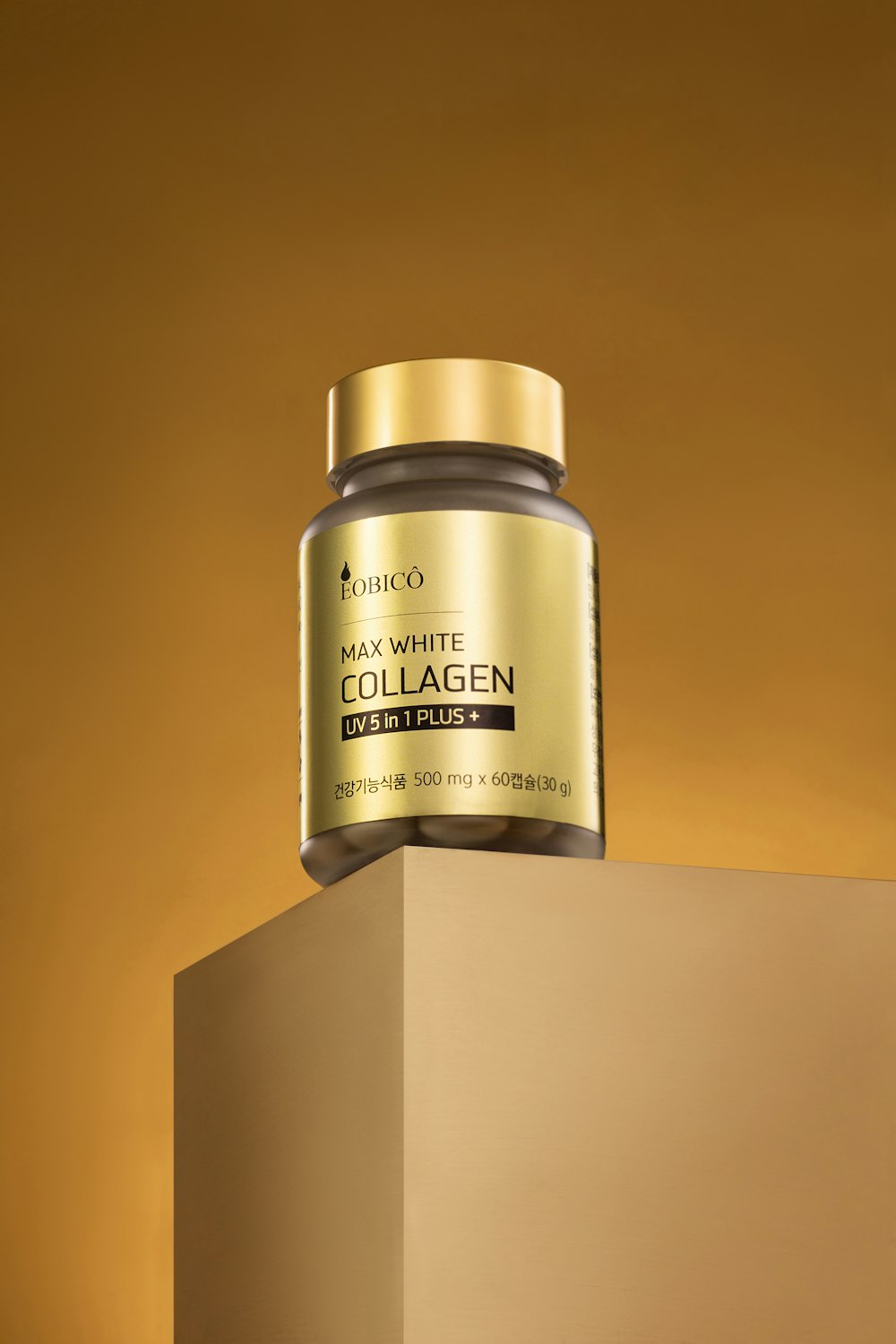 a jar of collagen on top of a box