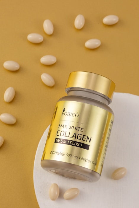 a jar of collagen on a plate with almonds