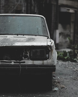 a car that is sitting in the dirt