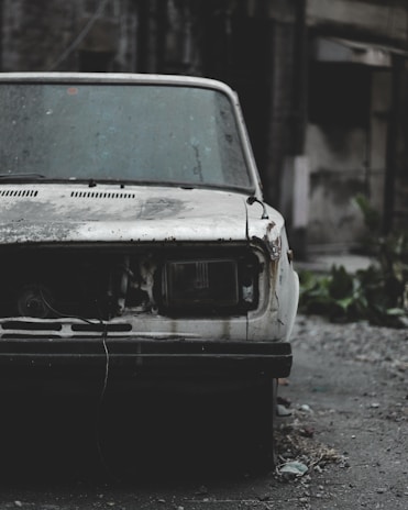 a car that is sitting in the dirt