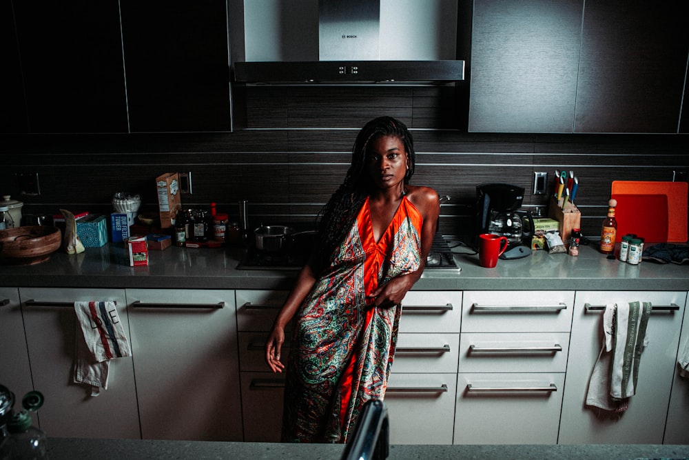 a woman standing in a kitchen