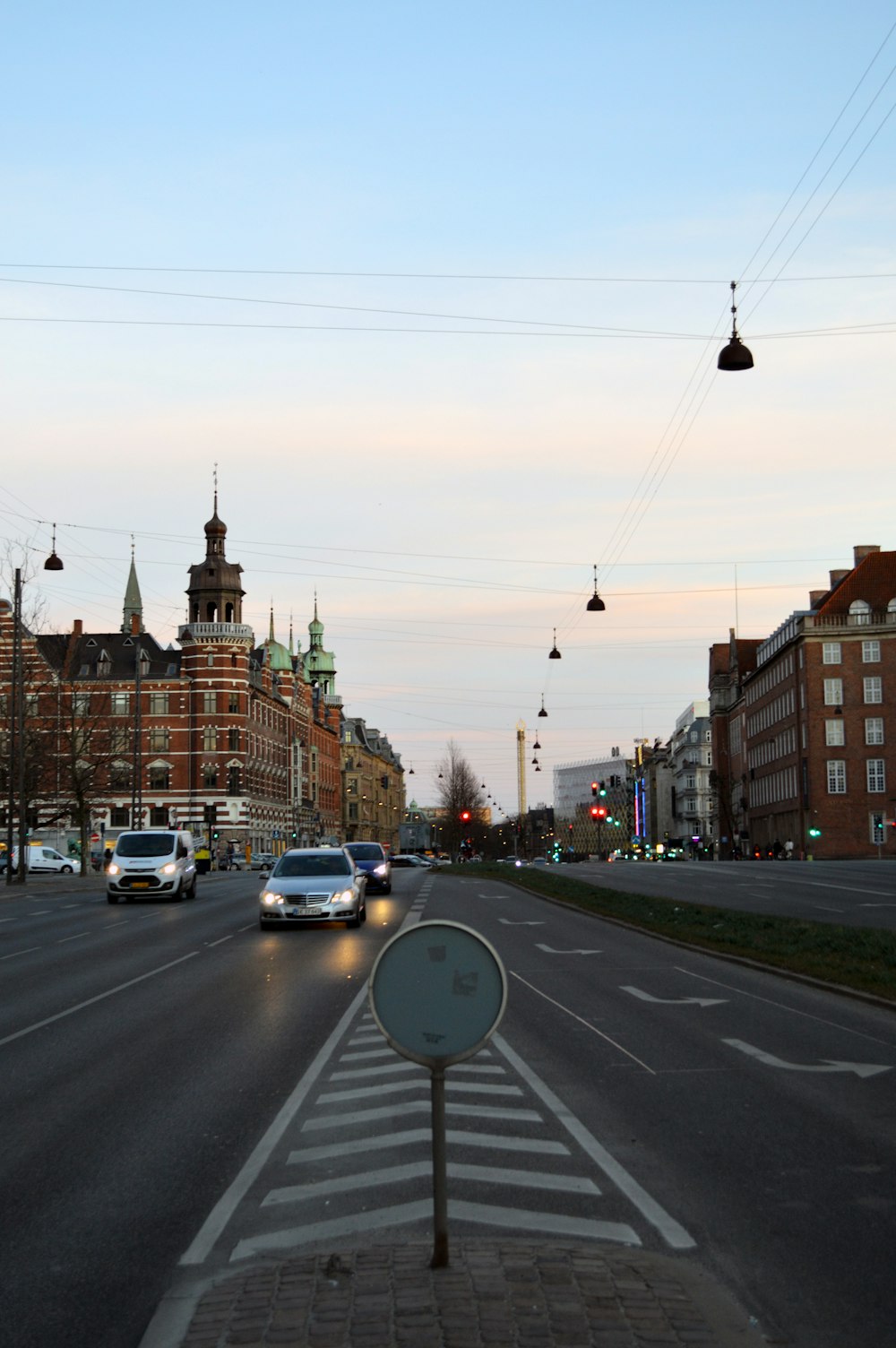 a city street with cars driving down it