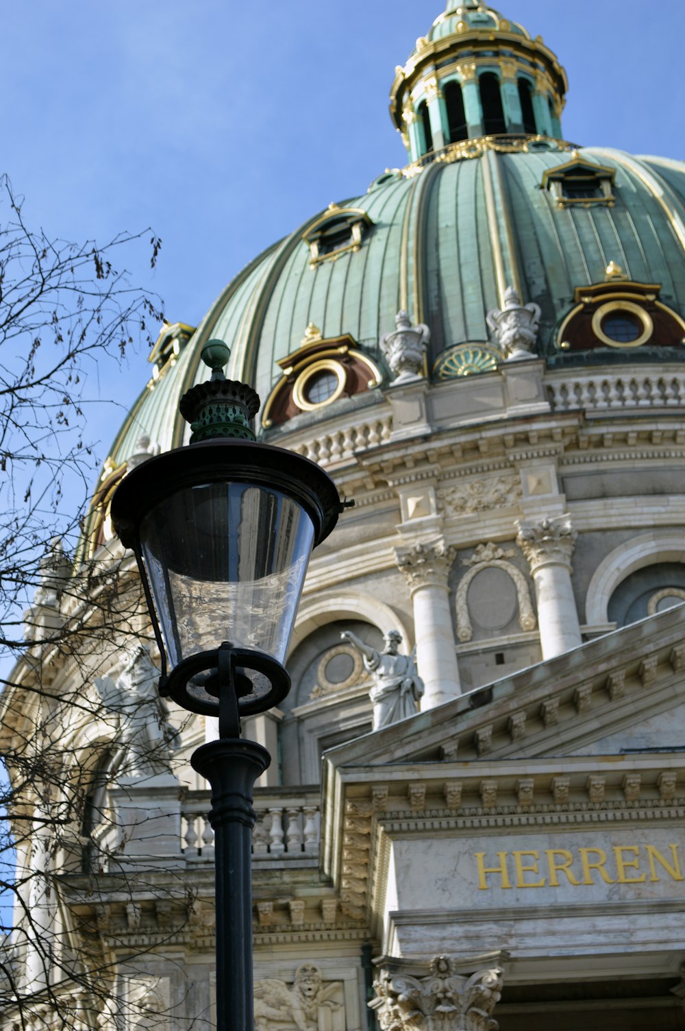 a street light in front of a large building