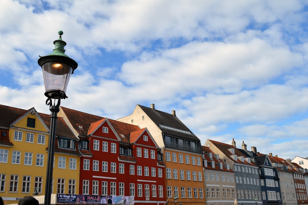 a street light in front of a row of buildings