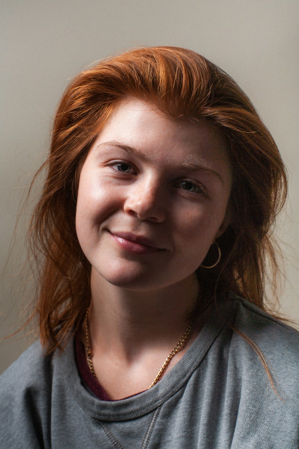 a close up of a person wearing a necklace