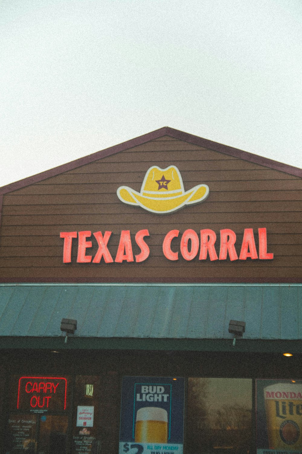 a store front with a cowboy hat on top of it