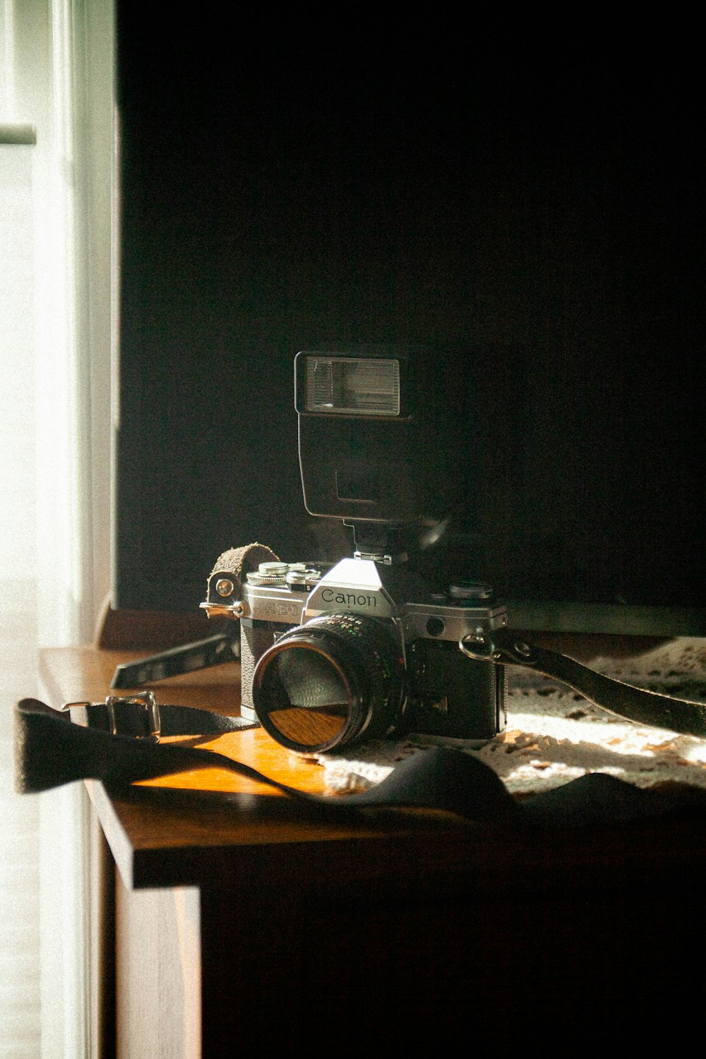 a camera sitting on top of a wooden table