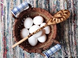 A basket filled with farm-fresh eggs and homemade butter wrapped in cloth