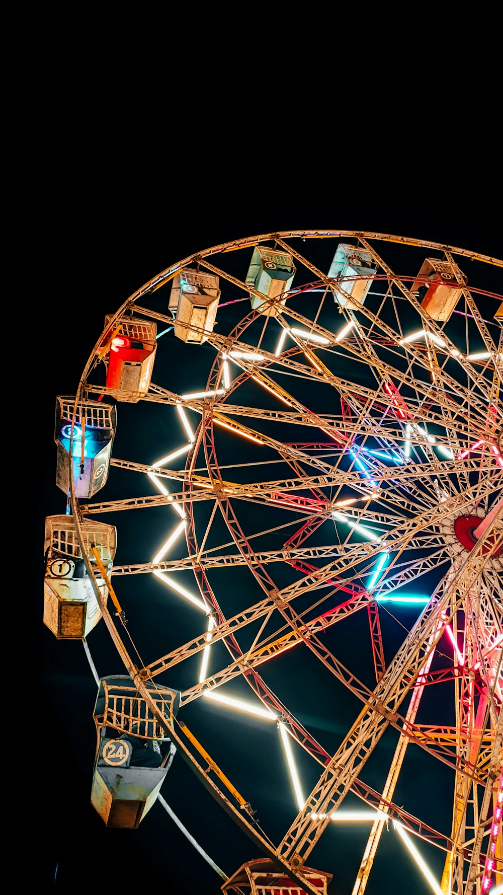 a large ferris wheel lit up at night