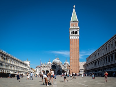a tall clock tower towering over a city