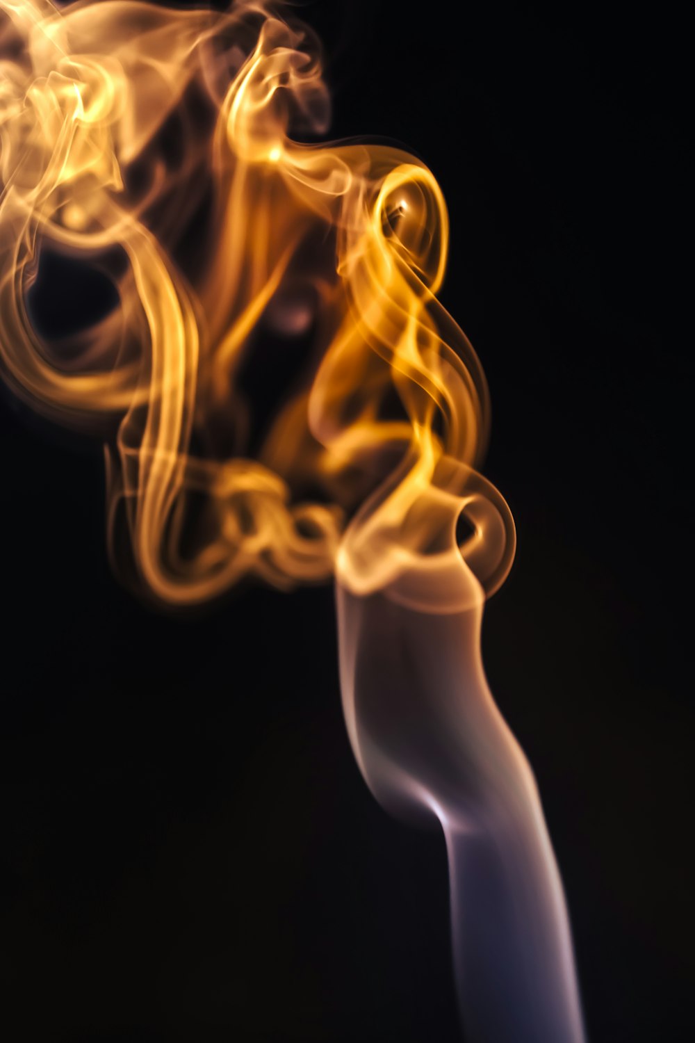 a close up of a smoke stack on a black background