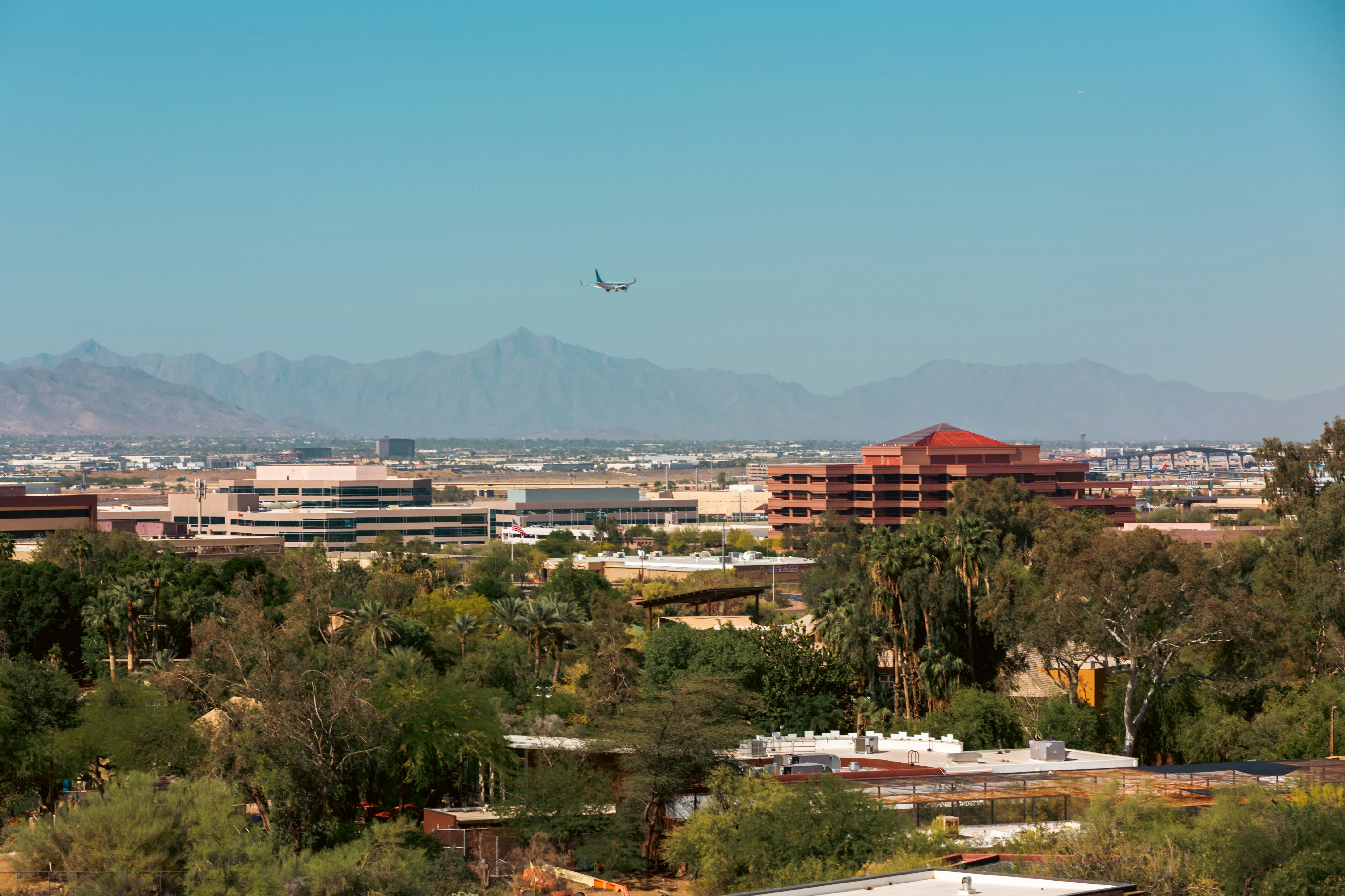 Beautiful Southern Arizona scene with airplane flying over