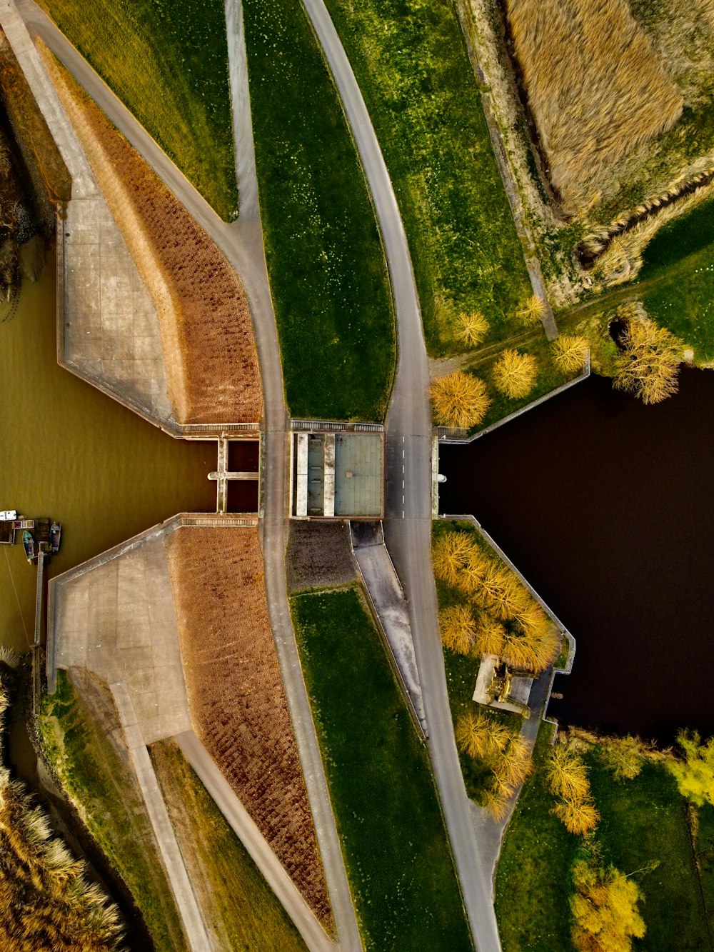 an aerial view of a river and a bridge