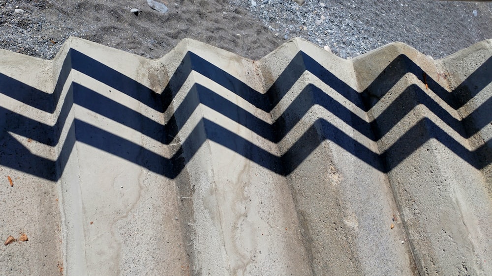 a close up of a cement wall with a chevron pattern
