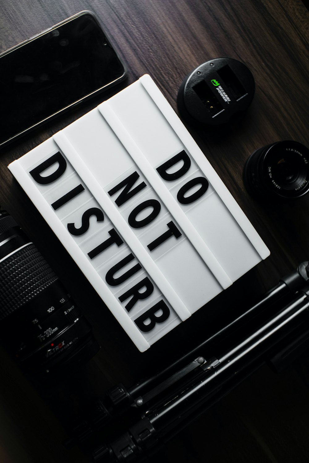 a camera and a sign that says do not disturb