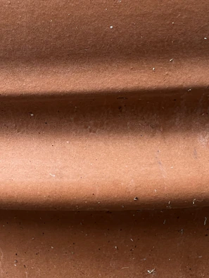 Close-up of the Shishira clay fridge showing its textured surface and natural finish.