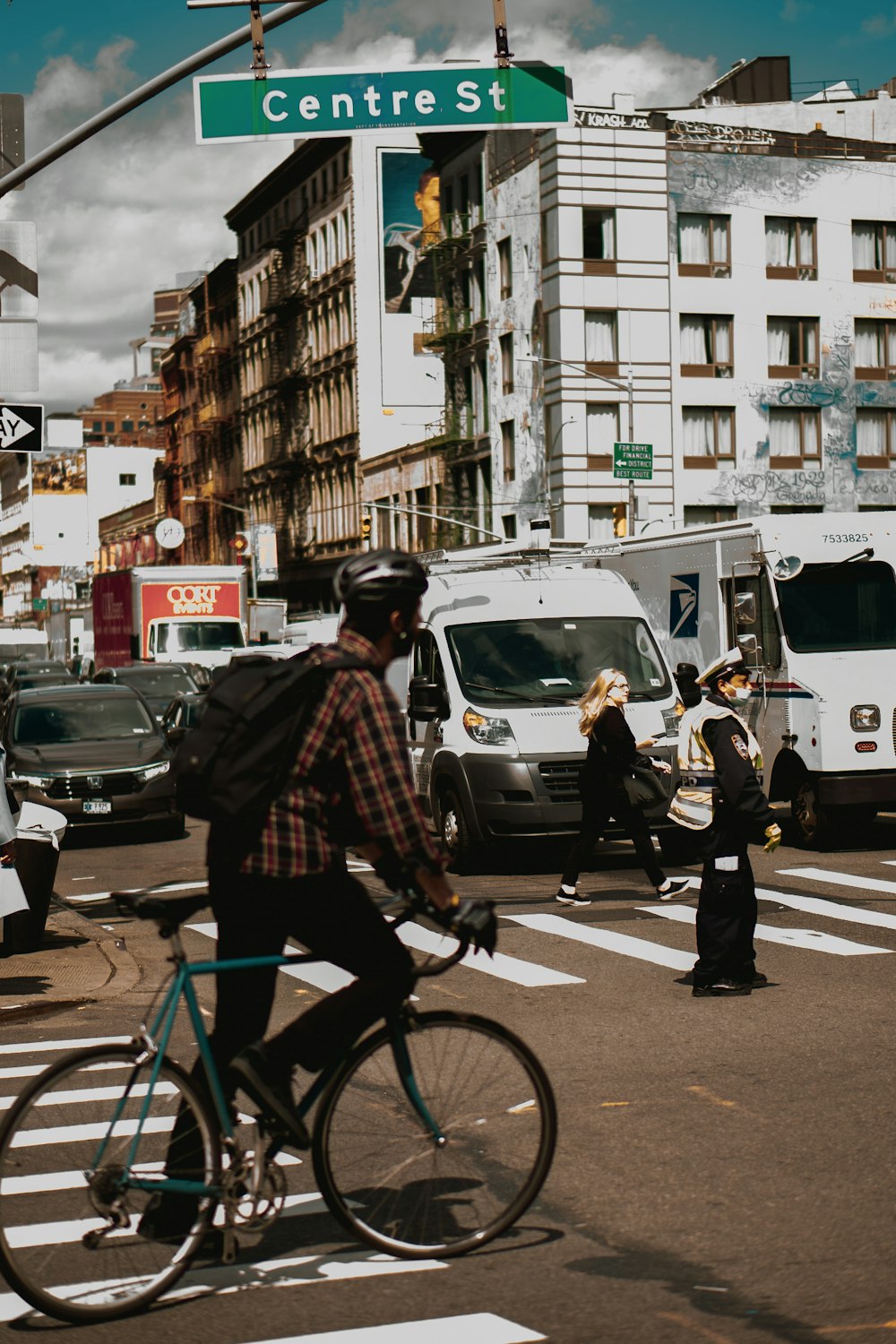 a man riding a bike across a street