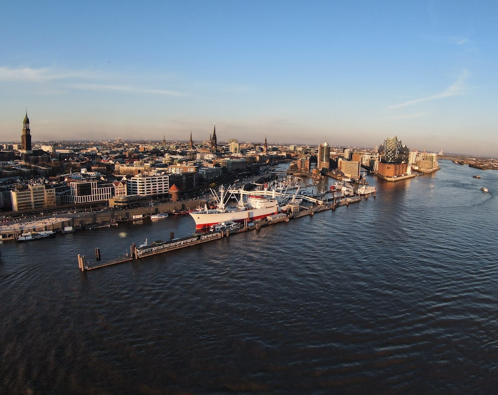 a large body of water with a city in the background