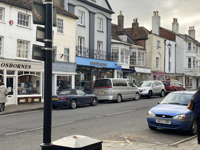 A warm, inviting shot of the Browns of Harborne shopfront on a bustling street in Birmingham.