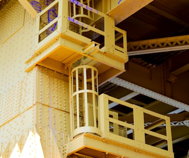 a yellow building with a bunch of balconies on top of it