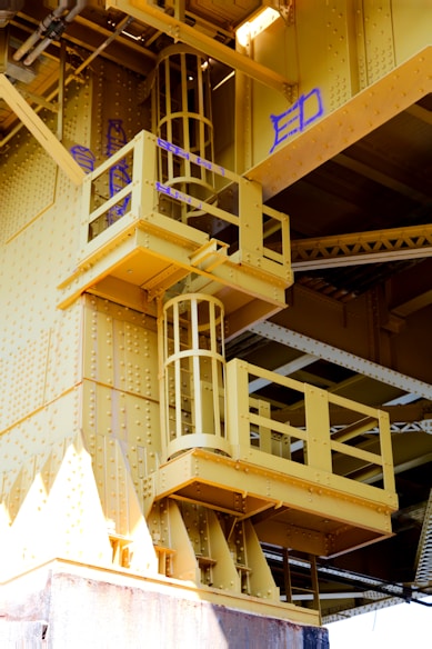 a yellow building with a bunch of balconies on top of it