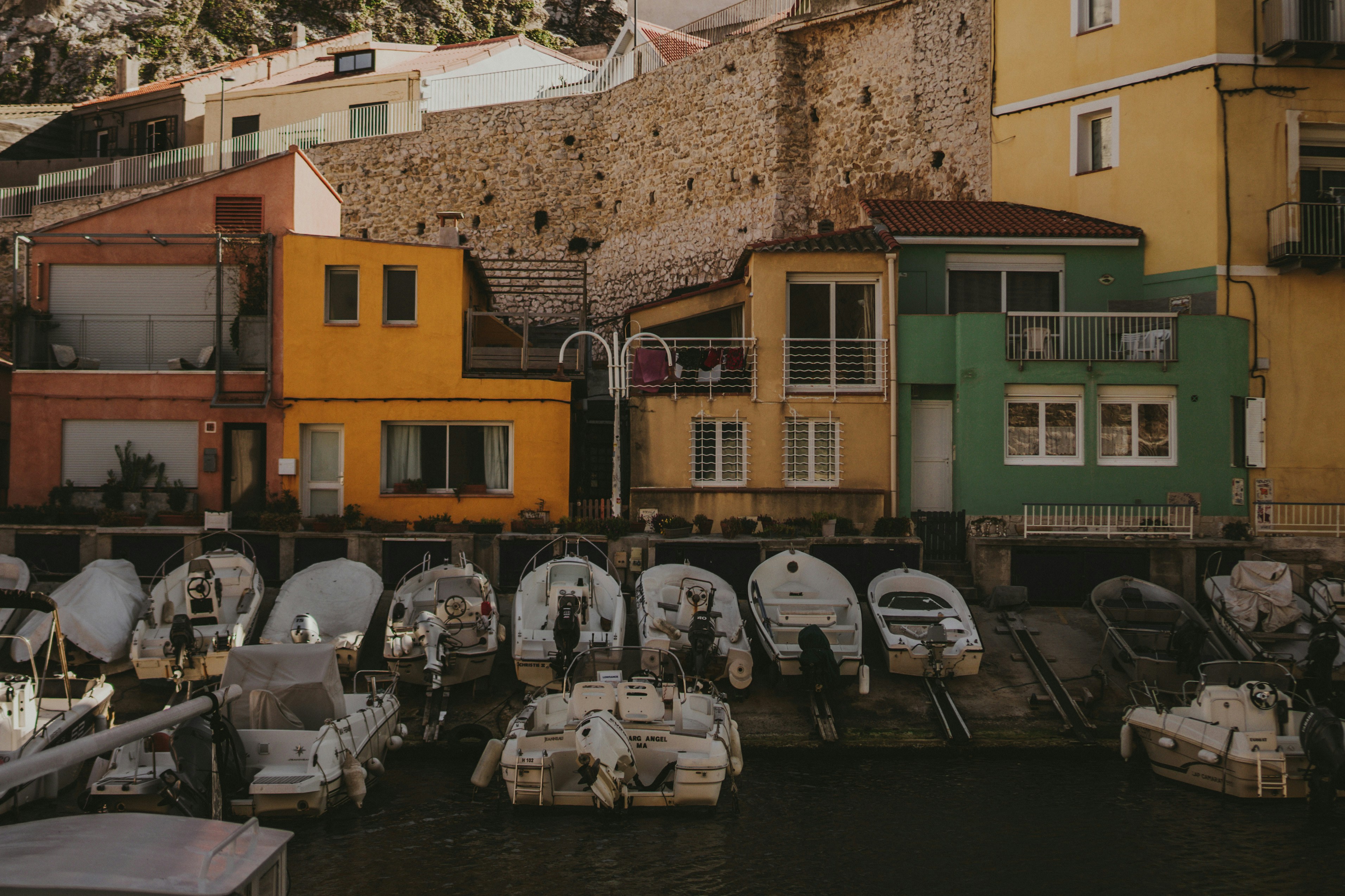 a bunch of boats that are sitting in the water, 