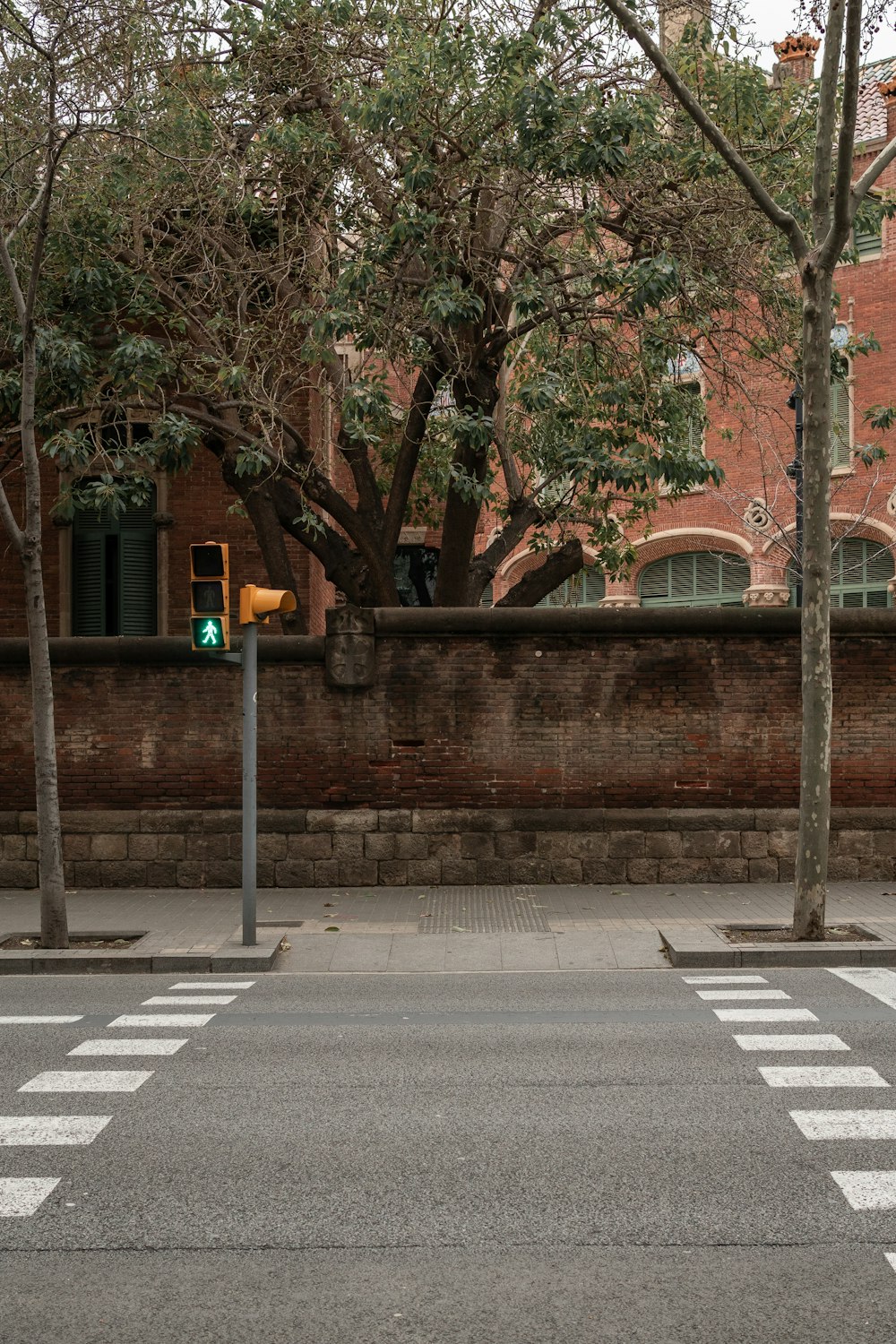 a crosswalk in front of a brick building