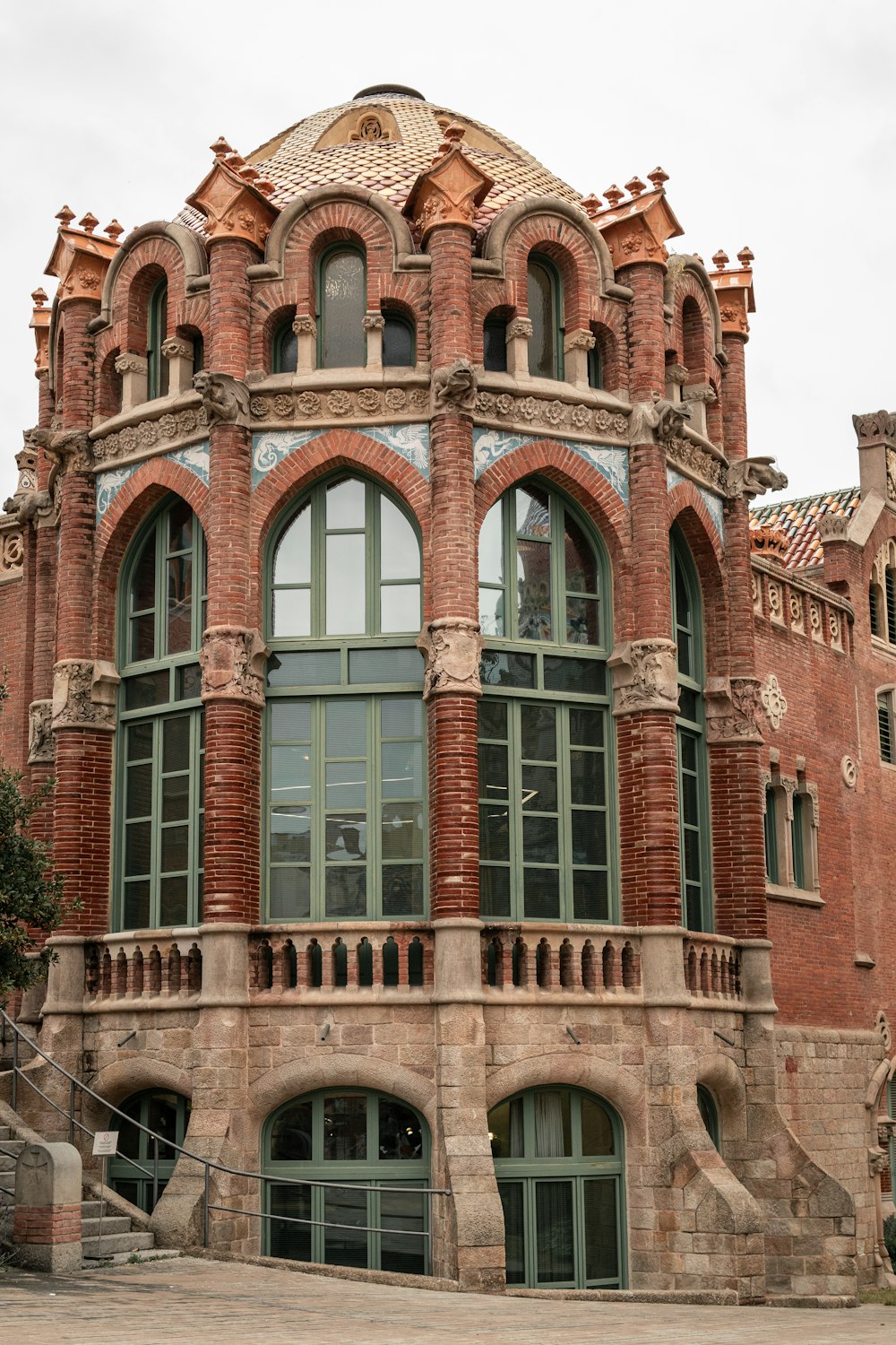 a large red brick building with arched windows