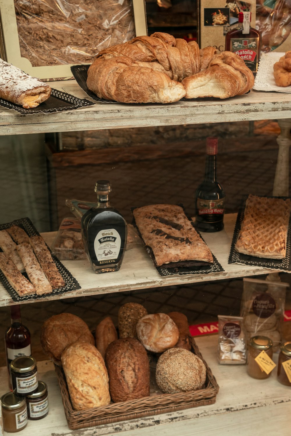 a bakery filled with lots of different types of bread