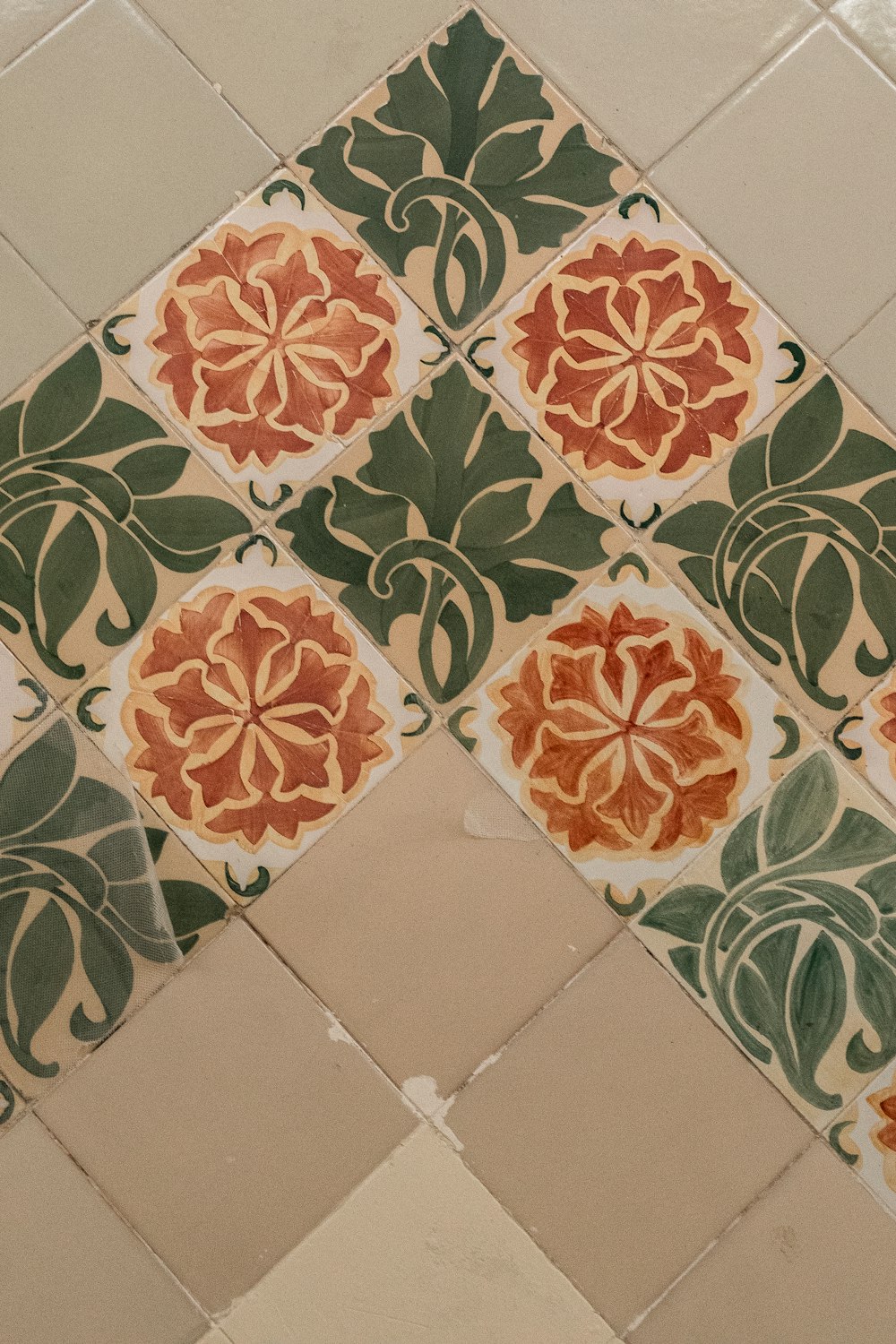 a tiled floor with a flower design on it