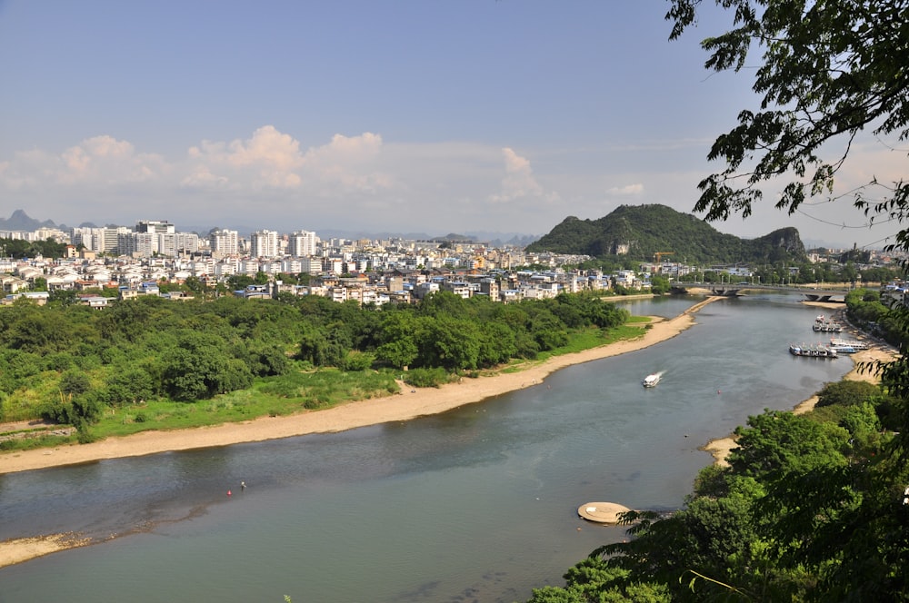 a river running through a lush green countryside