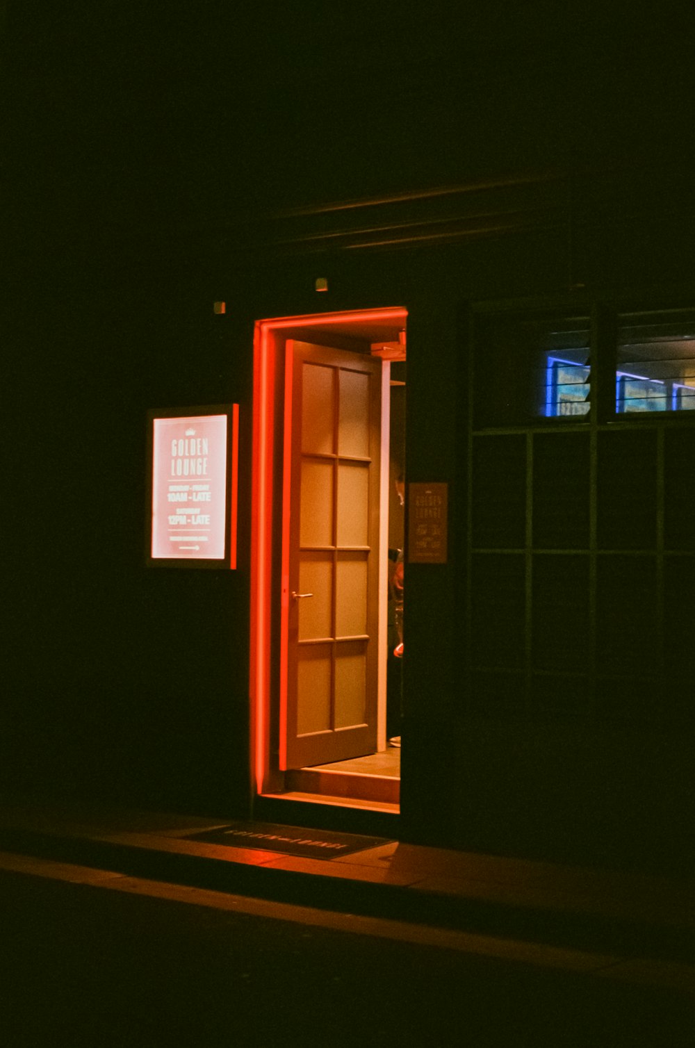 an open door in a dark room at night