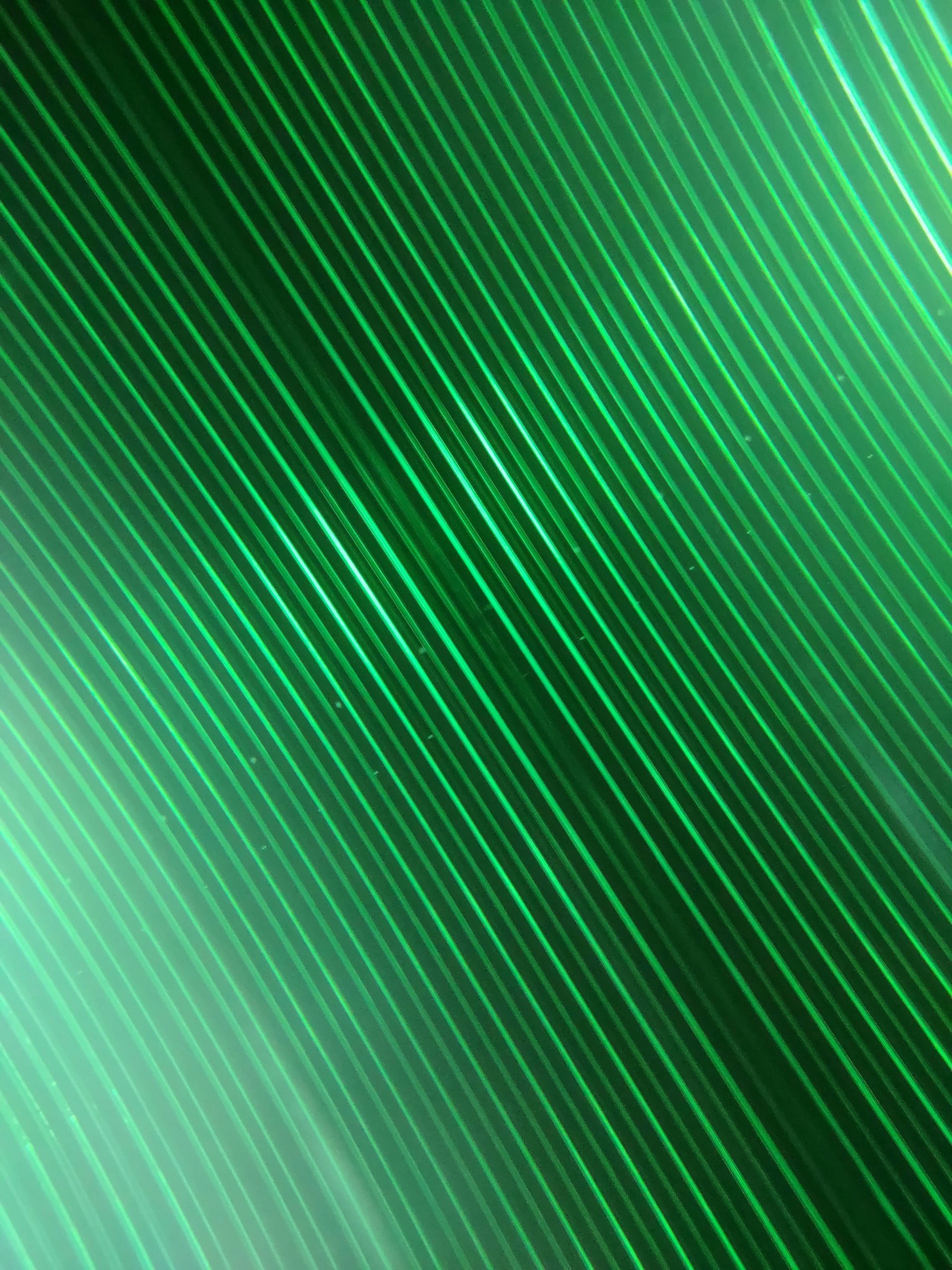 a green and black background with lines